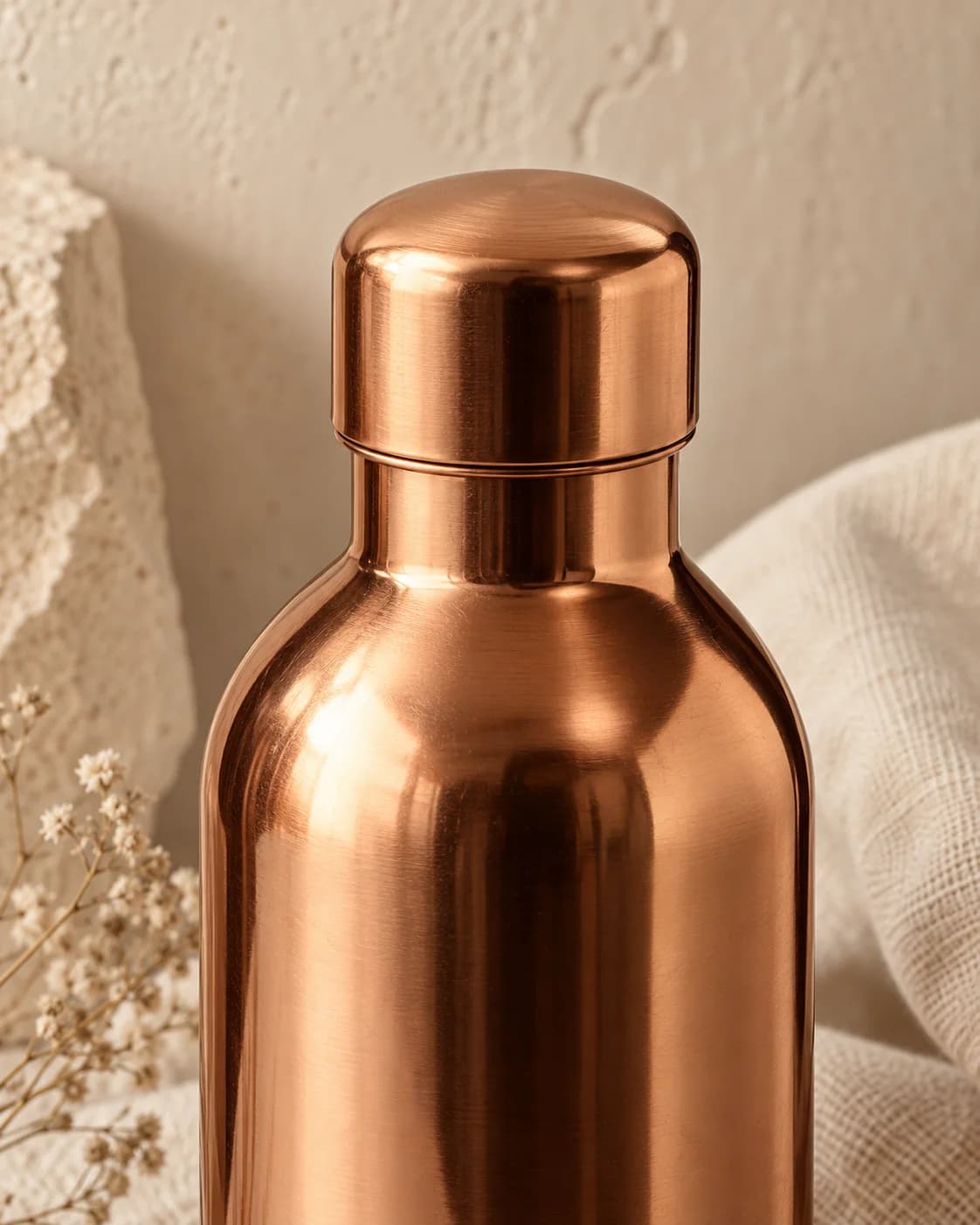 Close-up of the copper bottle lid and shoulder